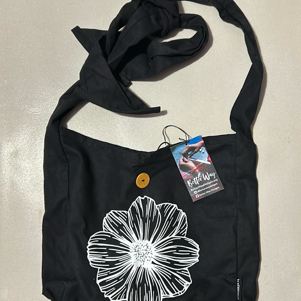 Women’s black tote bag with adjustable tie strap